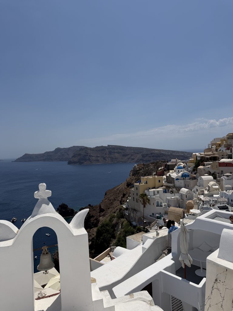 Bell Tower & Archway of Agios Nikolaos Church (left), Blue Domes of Agios Spyridon and Anastasi Church (right)