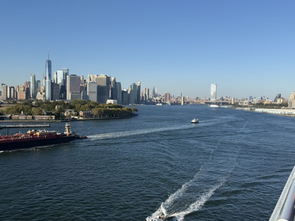 Manhattan skyline and Governors Island viewed from Valiant Lady in New York Harbor.